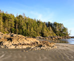 The sun behind the rocks at Tonquin Beach in Tofino